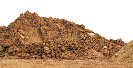 Brown mound isolates dug up and left on the ground to prepare for landfill to improve construction in rural Thailand. - obrazy, fototapety, plakaty