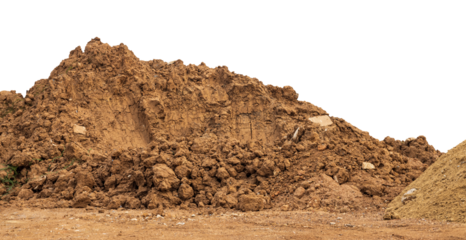 Brown mound isolates dug up and left on the ground to prepare for landfill to improve construction in rural Thailand.
