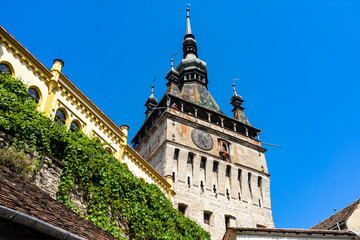 Obraz premium Medieval fortified citadel of Sighisoara city and the famous Clock Tower