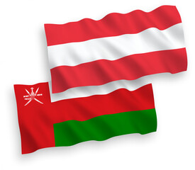 National vector fabric wave flags of Austria and Sultanate of Oman isolated on white background. 1 to 2 proportion.