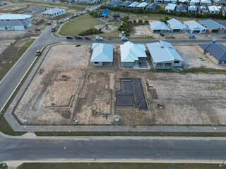 Aerial photo of construction site, new build houses at various stages of development