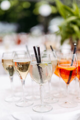 Alcoholic beverages at a wedding. Glasses and drinks at an event.