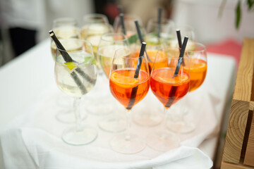 Alcoholic beverages at a wedding. Glasses and drinks at an event.