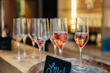 Alcoholic beverages at a wedding. Glasses and drinks at an event.