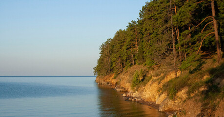 Great Baikal Trail. Popular route along lake Baikal shore from Listvyanka to Big Koty. Lake Baikal coast, hill with forest, water bay. Summer travel, discovery of beauty of Earth. Siberia, Russia. © Lena