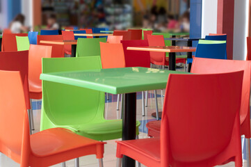 Colorful chairs and tables in the cafe.No people, empty interior