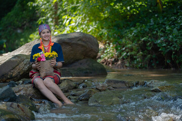Beautiful Asian young tribal lady in the native traditional dress culture of Karen people minority ethnic culture. Portraits of identity dress folk applying fashion concepts.