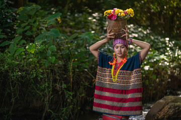 Beautiful Asian young tribal lady in the native traditional dress culture of Karen people minority...