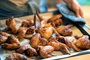 Home cooked chicken wings. Food and eating concept.