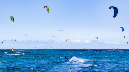 Hundreds of kite surfers enjoy the wind on the southern tip of the Bay of Le Morne in Mauritius