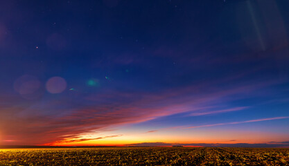 Orange sky after sunset or before dawn.