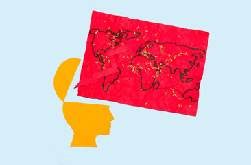 global food crisis, paper head from which a red world map with wheat falls out
