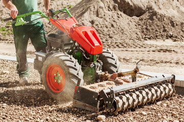 Soil Loosening tractor. Preparing gravel drainage for Lawn. Preparing land for Grass plot.