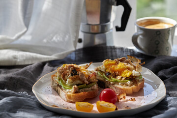 homemade delicious toast, topped with egg, summer squash, salmon and bonito