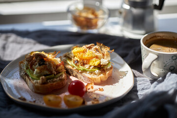 homemade delicious toast, topped with egg, summer squash, salmon and bonito