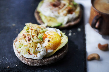 homemade delicious toast, topped with egg, tuna, cucumber and avocado