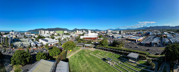 Aerial panorama of park and cityscape with mountains and peffect blue sky