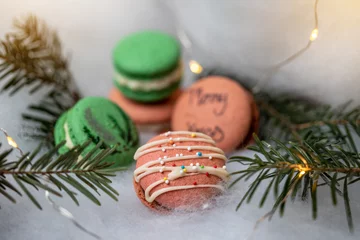  Christmas macarons on a cozy and warm background © Bedo