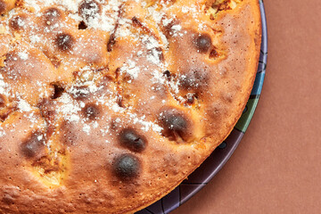 Homemade apple pie on a brown background