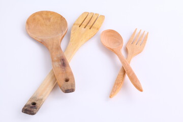 wooden kitchen utensil, spoon and fork on white background