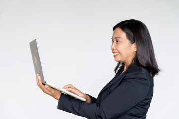 Business Woman Wearing Black Suit Jacket Holding and Looking on Her Laptop on White background