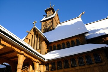 Old wooden stave church Vang (Wang) in winter. It was transferred from Norway and re-erected in...