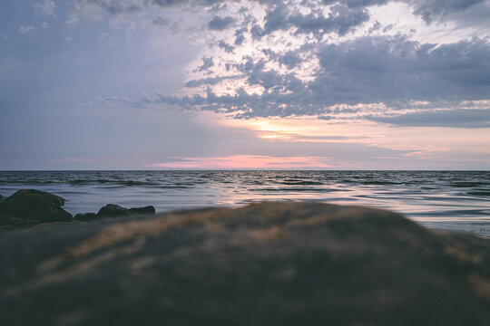 Tujas beach during purple sunset.