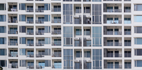 The exterior of modern condominiums is used full of glass, including sliding doors, windows and balconies. to avoid feeling cramped