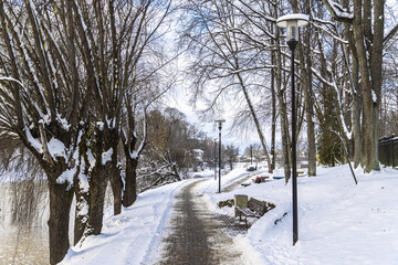 Winter road in town. Cleaned pathway with sand so it isn't slippery.