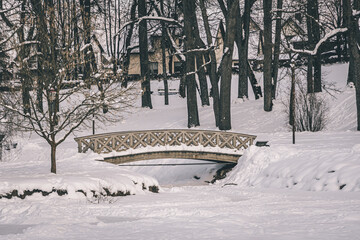 Wooden bridge in Cesis city park. Winter time.