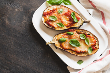 baked eggplant with tomatoes and mozzarella and basil