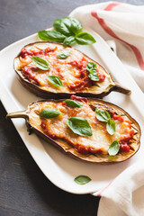 baked eggplant with tomatoes and mozzarella and basil