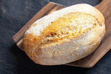 freshly baked bread on wooden cutting board