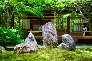 old stone statue in japanese garden