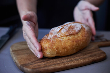 putting bread on cutting board