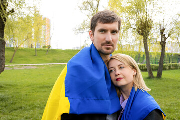Naklejka premium Young Ukrainian people outdoors in the park. The concept of freedom