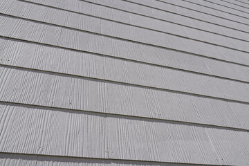 House facade with corrugated structured panels in white      