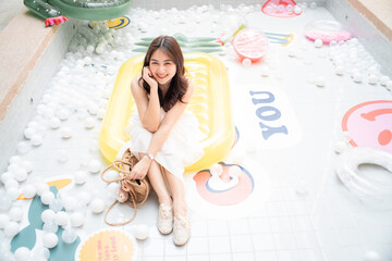 Fototapeta premium Pretty asian woman posting in coffee shop city travel