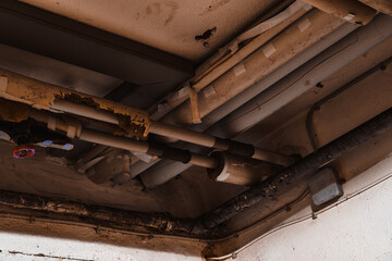 Old plumbing pipes on the ceiling oil pipe