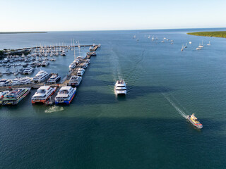 Aerial photo of boats coming in to dock at the harbour in Cairns