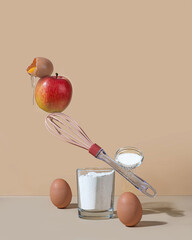Photo balance. concept - ingredients for cooking apple pie. Flour, eggs, sugar