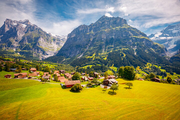 Breathtaking view of alpine Eiger village. Grindelwald valley, Swiss alps, Switzerland.
