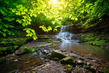 Obraz premium Gorgeous view of the unique waterfall on a sunny day. Carpathian, Ukraine.
