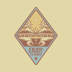 Diamond shaped emblem of hot cup in the forest