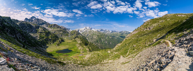 Naklejka na ściany i meble Lago dei Seracchi and behind the Rutor Glacier in a summer day