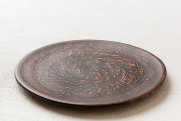Perspective view of empty plate on cement background. Empty space for your design