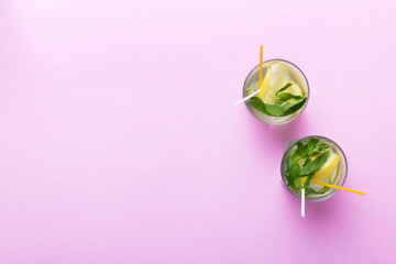 Caipirinha, Mojito cocktail, vodka or soda drink with lime, mint and straw on table background....