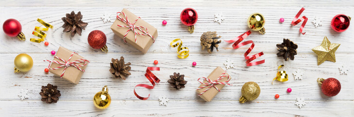 New Year composition. Christmas decor background with pine cones. Top view with copy space