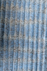 Dirty air cleaning filter covered with dust. Contaminated, planted, replaced air cleaning filter used for coronavirus. Blue grey air filter