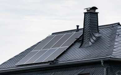 solar panels on a roof with slates or schist